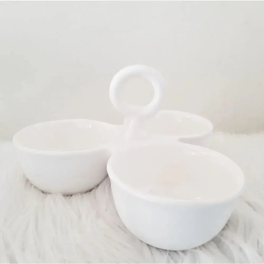 Condiment tray separated dishes.